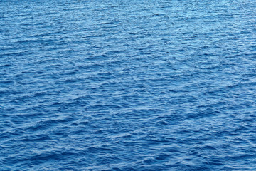 Blue water surface with strong wind