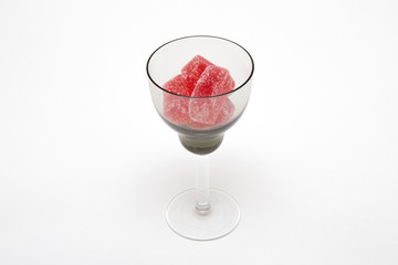 red marmalade in black wineglass on white