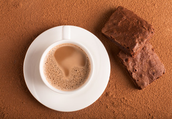 Cup of cappuccino and chocolate brownies