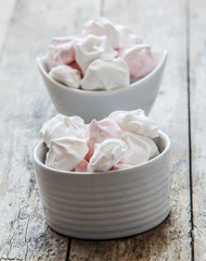 French meringue cookies on wooden background