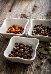different kinds of pepper in bowls