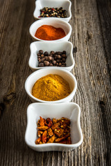 spices in bowls in a row