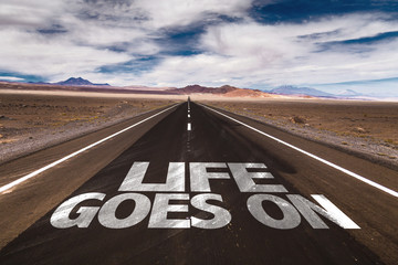 Life Goes On written on desert road