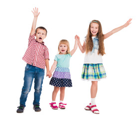 three children with hands up