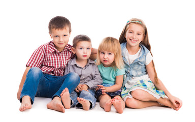Fototapeta na wymiar four cute children sitting on the floor