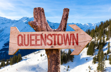 Queenstown wooden sign with winter background