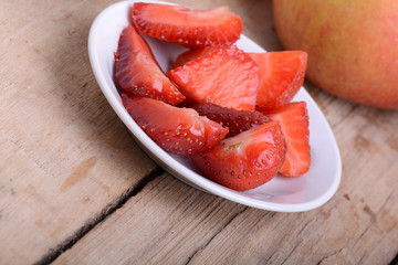 Strawberry slices and apple, closeup