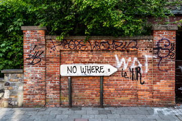 road to nowhere / a road sign that points the way to nowhere, symbol of the state of uncertainty of young people