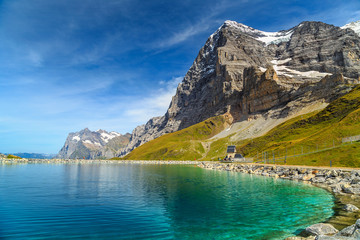 Naklejka na ściany i meble Alpine turquoise lake and Eiger North face,Bernese Oberland,Switzerland
