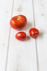 Fresh tomatoes on wooden board