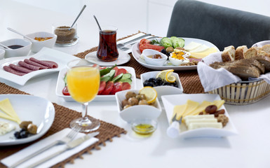 Rich and delicious Turkish breakfast on white wood table