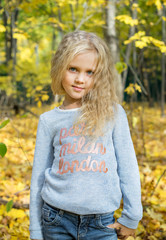  Beautiful young girl in autumn forest park