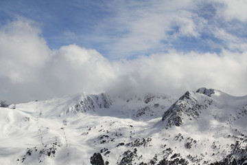 Fototapeta na wymiar Clouds over the mountain range in Andorra