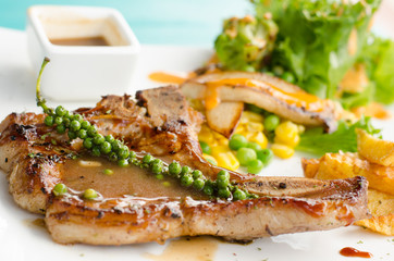 grilled t-bone steak and vegetables