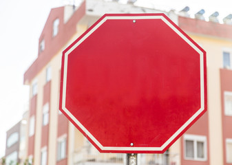 Photograph of a blank red traffic stop sign with all text