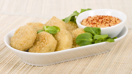 Deep Fried Cheese - Breaded and deep fried cheese served with dipping sauce.
