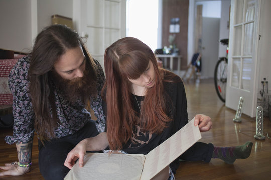 Young couple looking at a record album