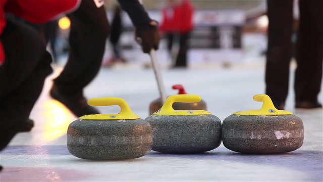The stones for Curling on the ice.