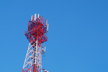 Transmitting antenna tower for mobile phone in the midst of blue sky