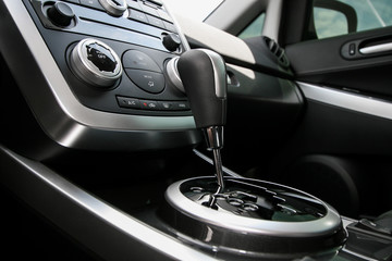 Fototapeta na wymiar Modern car interior, gearstick close up photo