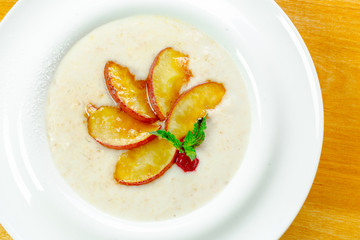 Trendy porridge decorated with fruits