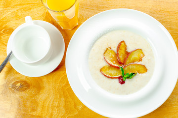 Trendy porridge decorated with fruits