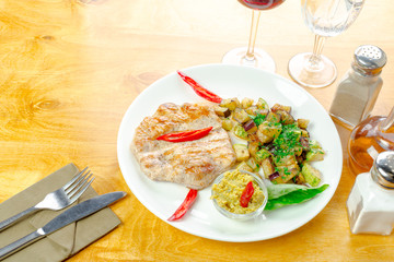 Grilled chicken fillet with grilled eggplant salad