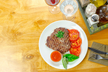 Steak with grilled tomatoes