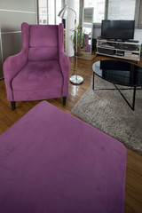 violet armchair in modern apartmet interior