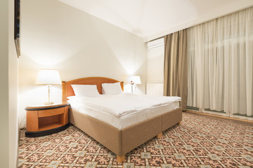 Hotel bedroom interior in the evening