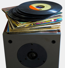 Vinyl records 45 rpm laid on a loudspeaker.