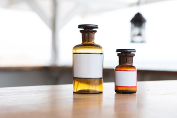 Vintage medicine bottles on sea background
