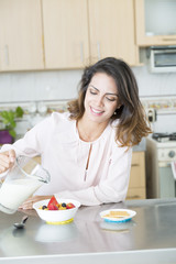 Attractive woman having breakfast