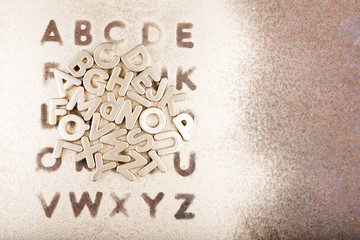Gold English alphabet on a gold background