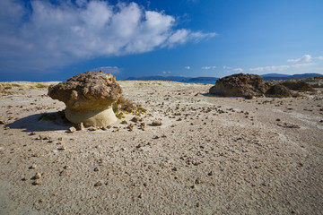 Rock formations of eroded volcanic rocks nearby Sarakiniko beach in the north of Milos island.