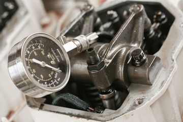Technician performs adjusting Rocker arm of exhaust valve and intake valve, Pressure tested for...