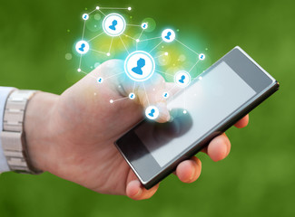 Finger pointing on smartphone, social network concept