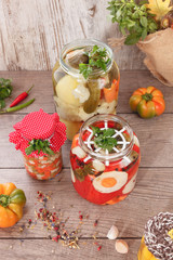 Preserved vegetables. Still life with pickled vegetables and herbs