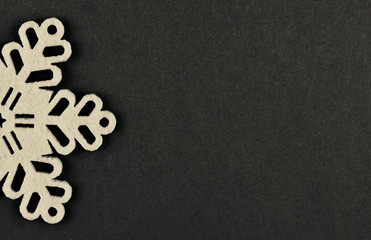 Unusual design christmas background with beige snowflakes and copy space on brown background