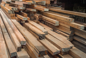 Building materials and timber supplies stacked up in a builders merchants yard.