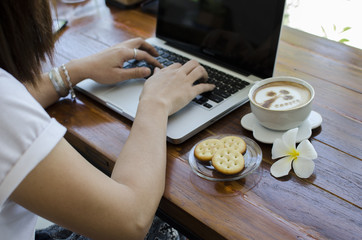 Fototapeta na wymiar Coffee with notebook on the wood table
