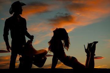 silhouette woman in bikini side knees head look up with cowboy