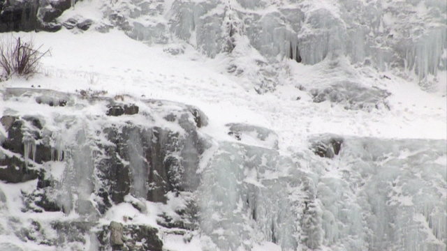 Ice climbers pan up mountain HD