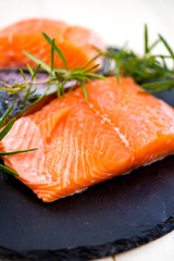 Portions of Fresh Salmon Fillets with Aromatic Herbs and Spices