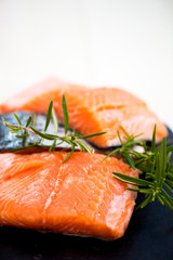 Portions of Fresh Salmon Fillets with Aromatic Herbs and Spices