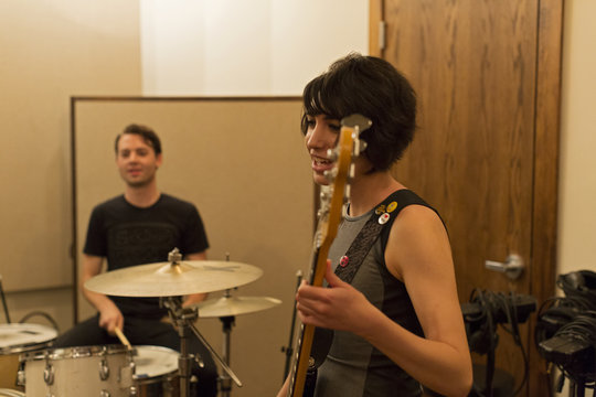 Young musicians practicing at a rehearsal space