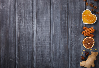 Mulled wine,ingredients.Christmas or winter warming drink. Honey, orange, cinnamon sticks, cloves ,ginger,cardamom and sugar.Copy space.selective focus