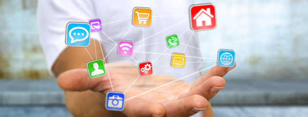 Young man holding digital application