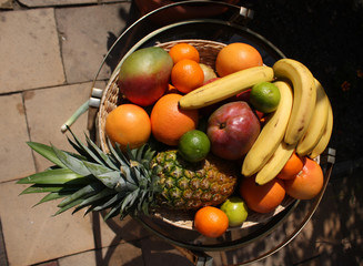 Different tropical fruits on table.