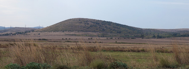 Field and located far from the hill